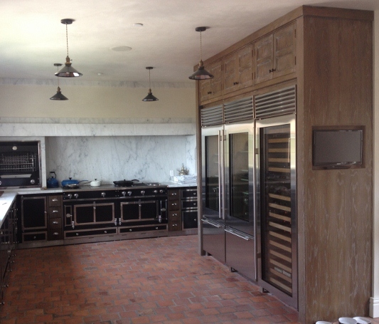 Custom La Cornue Kitchen with White Oak Built In Refrigerator Cabintry